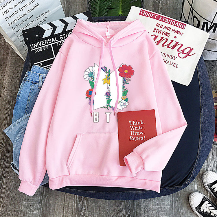 Pink youth pullover hoodie with flower heart front graphic and B T S print
