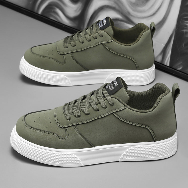 Olive green sneakers with white sole and lace-up closure