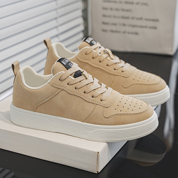 Beige sneakers with white sole, lace-up front, shown on a box