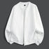 White textured zip-up coat with relaxed bomber silhouette and ribbed cuffs