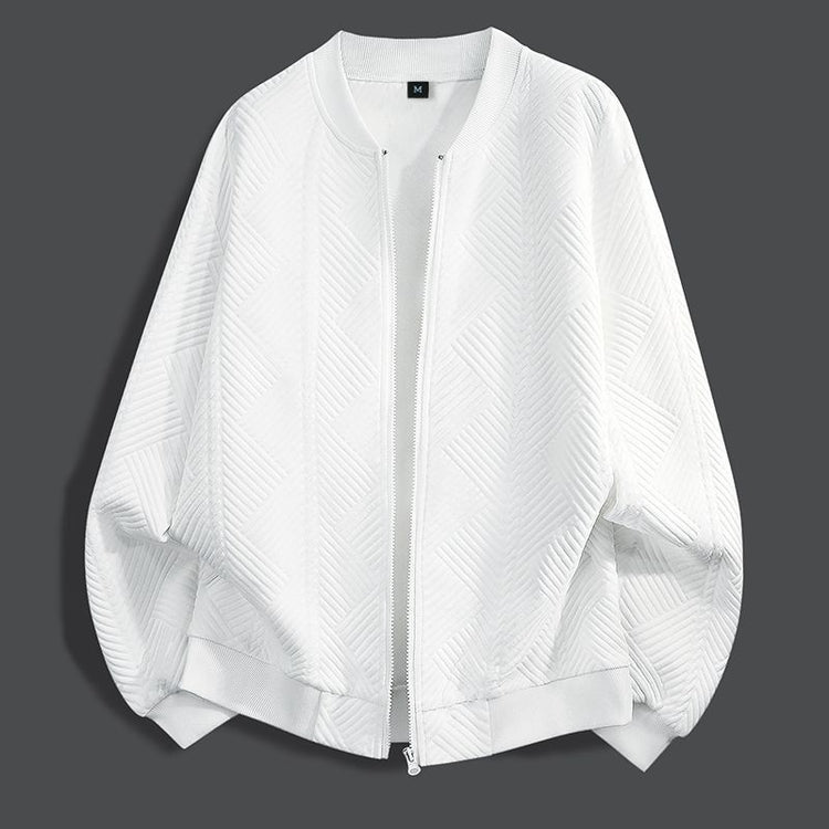 White textured zip-up coat with relaxed bomber silhouette and ribbed cuffs