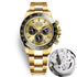 Gold-tone mechanical-style men’s watch with champagne dial and open caseback inset
