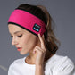 Hot pink Bluetooth headband with black control panel and trim