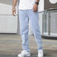 Light blue slim jeans with tapered leg and button-fly front