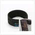 Dark gray Bluetooth headband with control panel and included product card