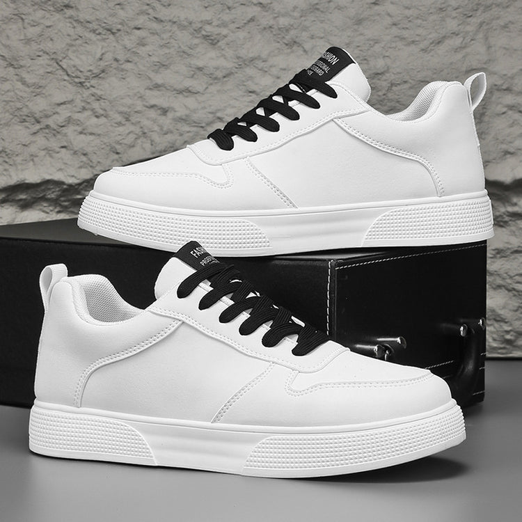White sneakers with black lace-up accents and textured white sole