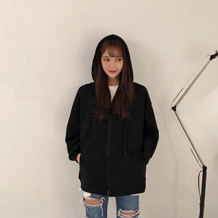 Black zip-up hoodie jacket with hood and drawstrings, front zipper, relaxed fit.