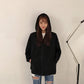 Black zip-up hoodie jacket with hood and drawstrings, front zipper, relaxed fit.