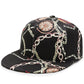 Black baseball cap with floral and chain pattern print, curved brim