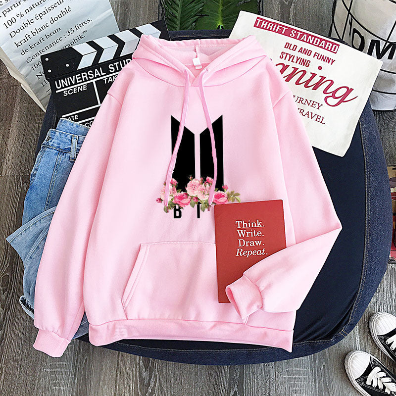 Pink youth hoodie with heart-flower garland graphic, drawstring hood and front pocket