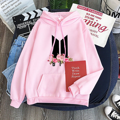 Pink youth hoodie with heart-flower garland graphic, drawstring hood and front pocket