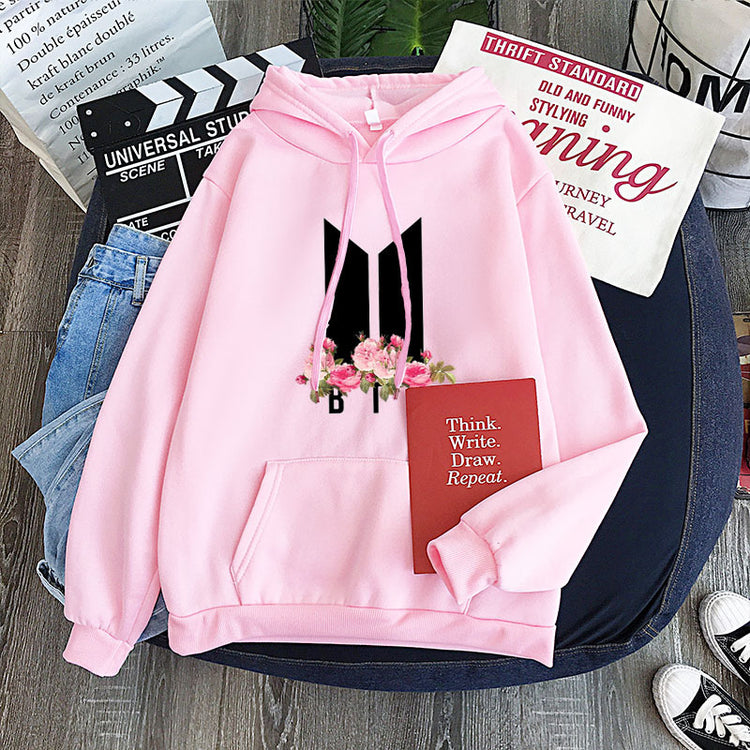 Pink youth hoodie with heart-flower garland graphic, drawstring hood and front pocket