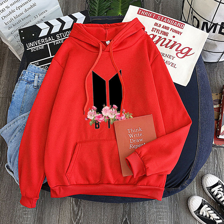 Red youth hoodie with heart-flower garland graphic, drawstring hood and front pocket
