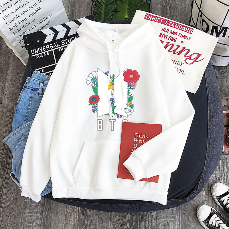 White youth hoodie with colorful heart-flower garland graphic and front kangaroo pocket