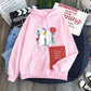 Pink youth pullover hoodie with flower heart front graphic and B T S print