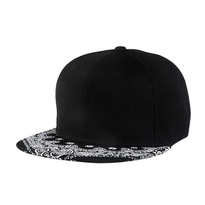 Black baseball cap with white paisley print brim and rounded crown