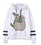 White fleece hoodie with cat graphic, black drawstrings, and striped sleeve cuffs