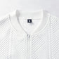 White textured zip-front coat close-up, stand collar and zipper pull
