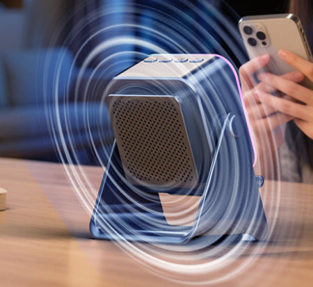 Black folding phone stand speaker with perforated speaker grille beneath phone