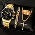 Quartz watch set with gold-tone watch, curb bracelet, gold cross pendant, and etched ring