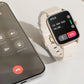 Waterproof smartwatch with white strap, gold case, call interface on full display