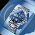 Blue stainless steel wristwatch on blue cushion, starry luminous dial