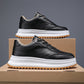 Black lace-up sporty casual shoes with chunky sole and contrast stitching
