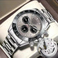 Silver-tone mechanical-style men’s watch with light dial and open caseback inset