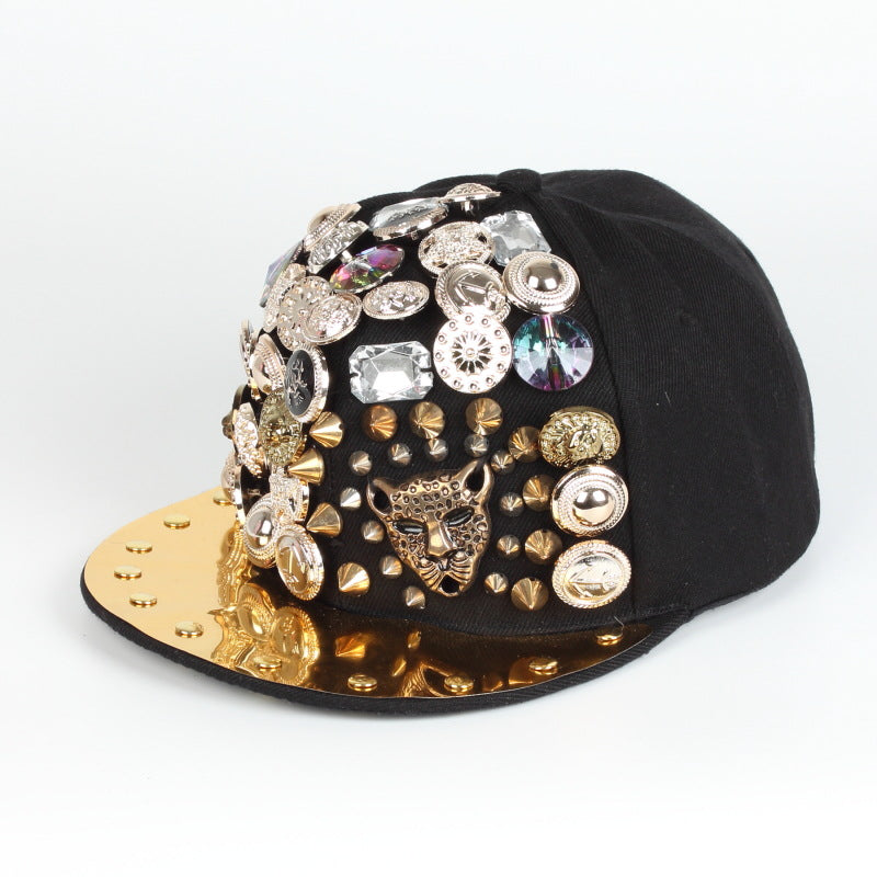 Black baseball cap with gold brim, rhinestone charms and leopard-style face detail