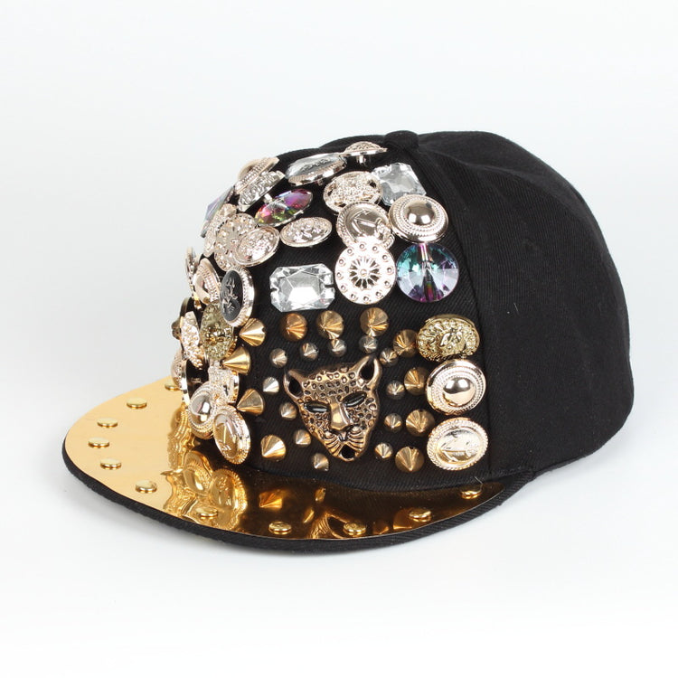 Black baseball cap with gold brim, rhinestone charms and leopard-style face detail