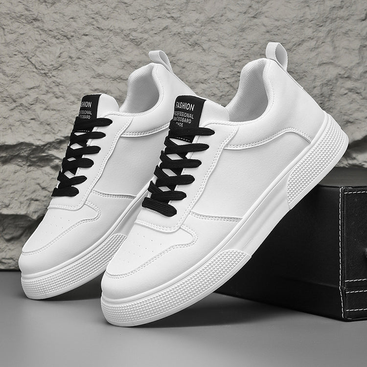 White sneakers with black lace-up details and textured white sole