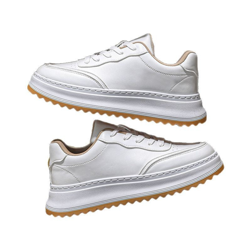 White lace-up sneakers with chunky sole, tan accents, and stitched paneling