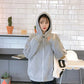 Light gray zip-up hoodie jacket with hood, long sleeves, and front zipper closure.