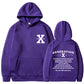 Loose hoodie in purple with hood, front pouch pocket, and chest/back graphic print.