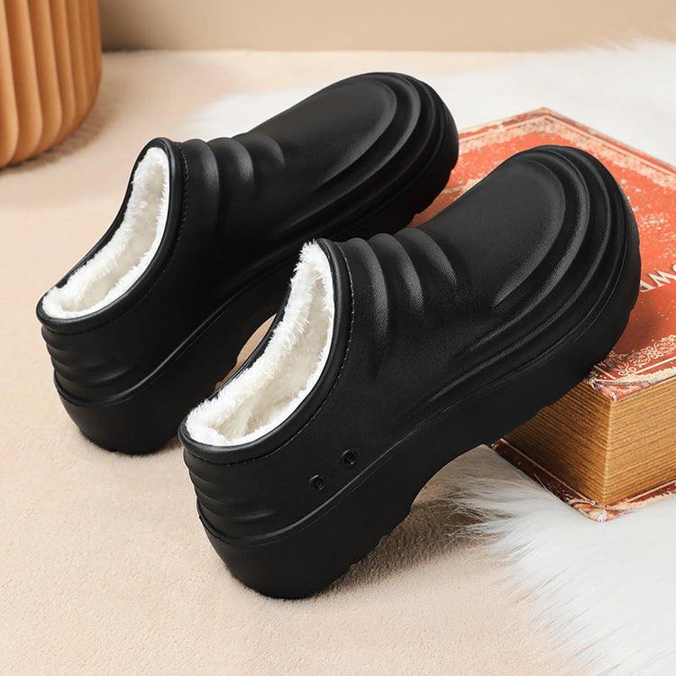 Black insulated chef clogs with open collar showing white fleece lining and sturdy sole