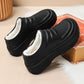 Black insulated chef clogs with open collar showing white fleece lining and sturdy sole