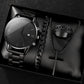 Quartz watch set with silver-tone watch, link bracelet, cross necklace, and dark ring