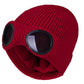 Red knit beanie with windproof goggle inserts and faux-fur ear covers