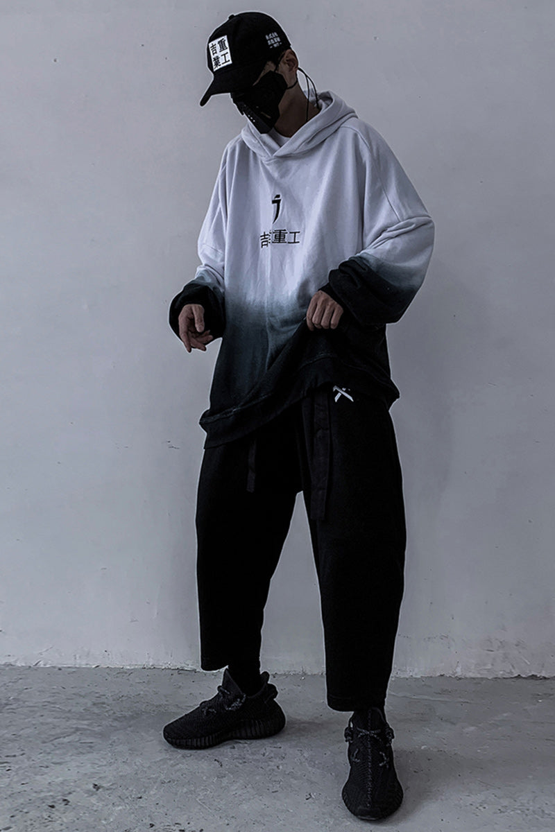 Gradient hoodie with hood and kangaroo pocket, white-to-dark finish and chest print.