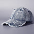 Washed denim baseball cap with frayed brim and distressed side panel, light wash denim.