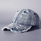 Washed denim baseball cap with frayed brim and distressed side panel, light wash denim.