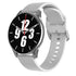 Smartwatch with gray case and white silicone band, round black face with analog time.