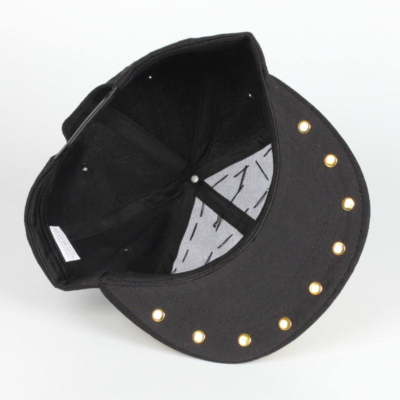 Black baseball cap interior with mesh back panel and gold button rivets