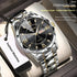 Quartz wristwatch with black dial, silver bracelet with gold links, day-date window at 3