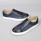 Lace-up embossed leather casual shoes in sapphire blue with white rubber sole