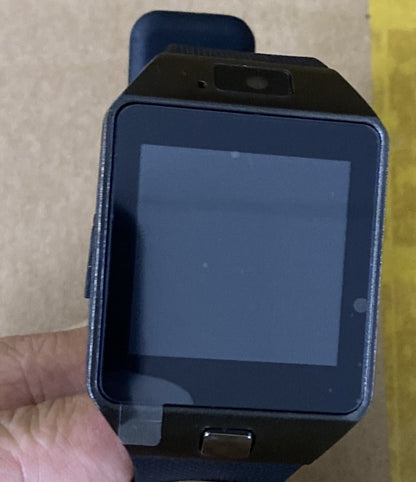 Smart watch close-up with dark screen, black case and blue-backed strap