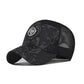 Baseball cap in black with red speckled pattern, mesh side panels, round logo badge