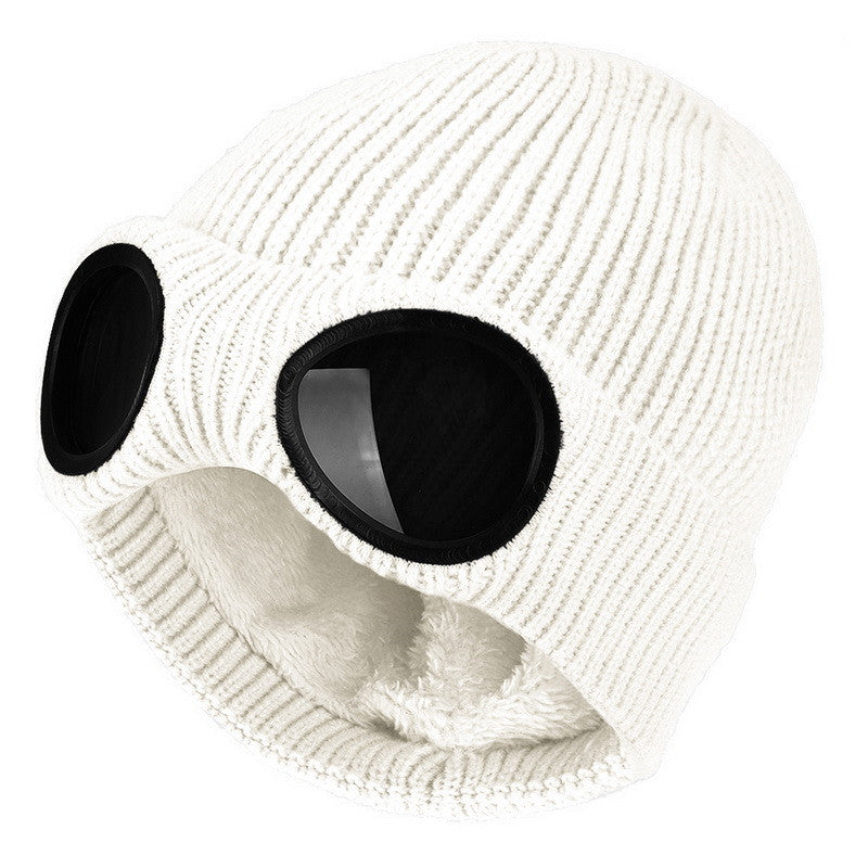 White knitted beanie with windproof eye shields, close-up