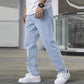 Light blue slim jeans with five-pocket styling and stitched seams