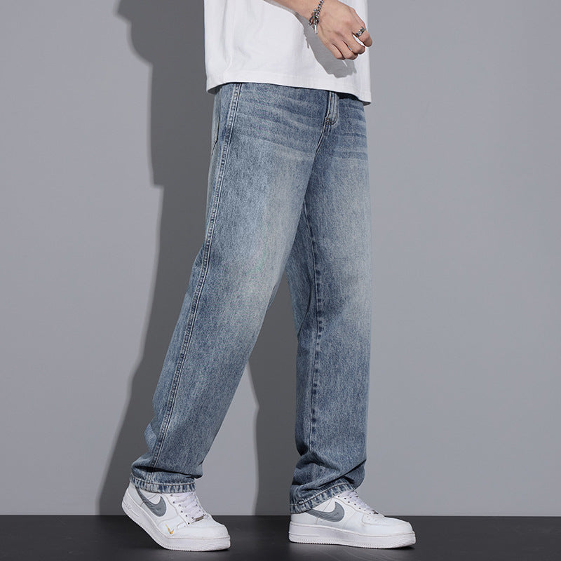 Light blue straight jeans, relaxed loose legs with front pockets and cuffed hem